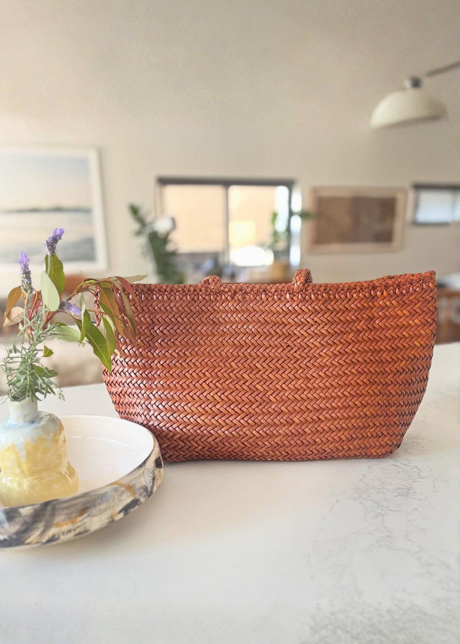 Woven basket on a table with a blurred indoor background