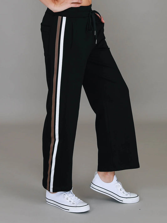 Black pants with white and gold stripes 