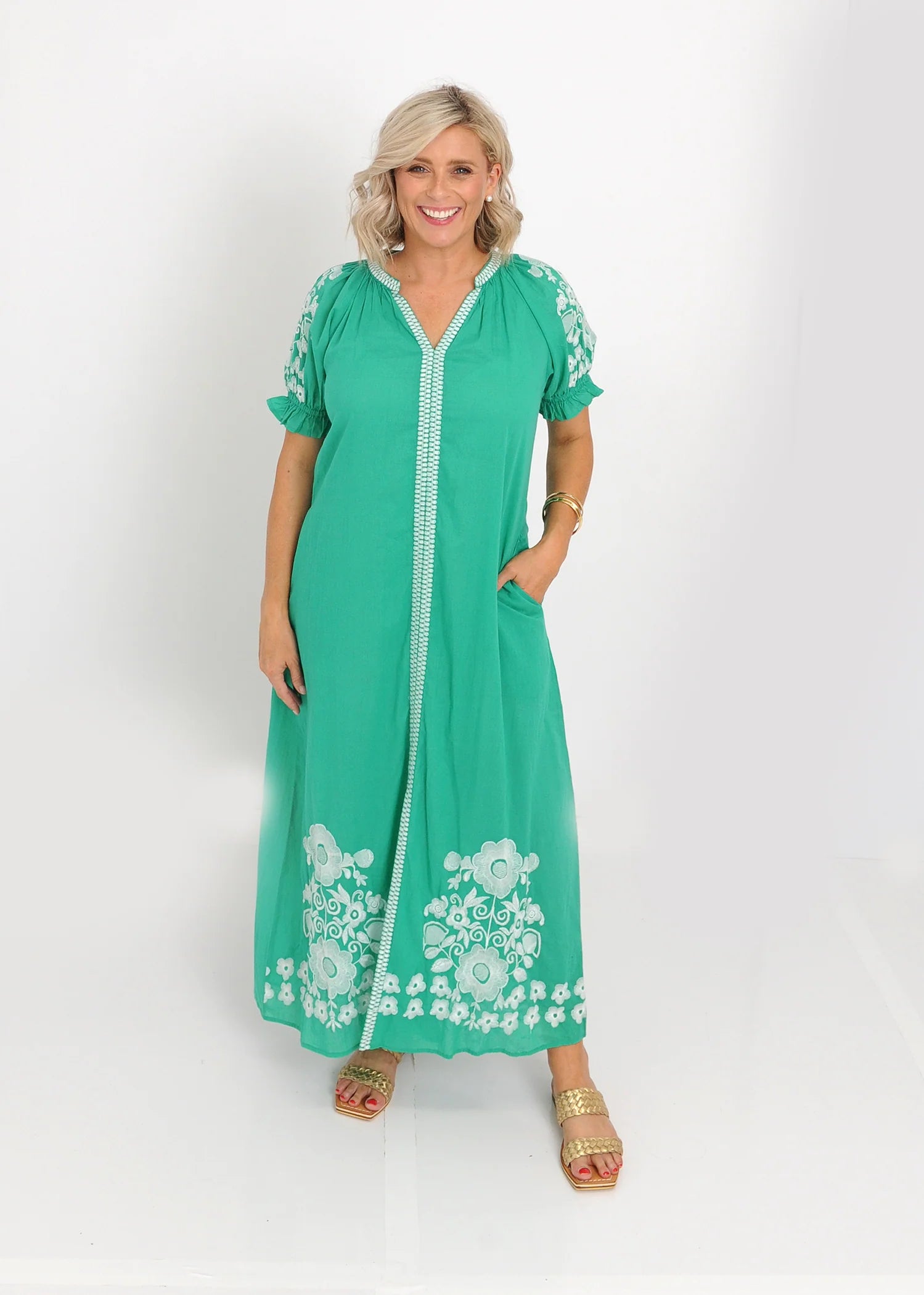 Green embroidered midi dress styled for daytime wear