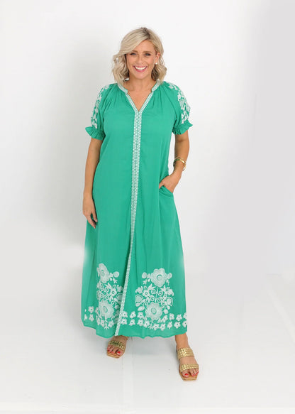 Green embroidered midi dress styled for daytime wear