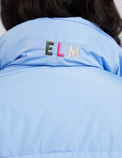 Light blue jacket with 'ELM' embroidered on the back