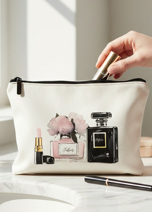 Cosmetic bag with perfume design on a marble surface, hand reaching in.