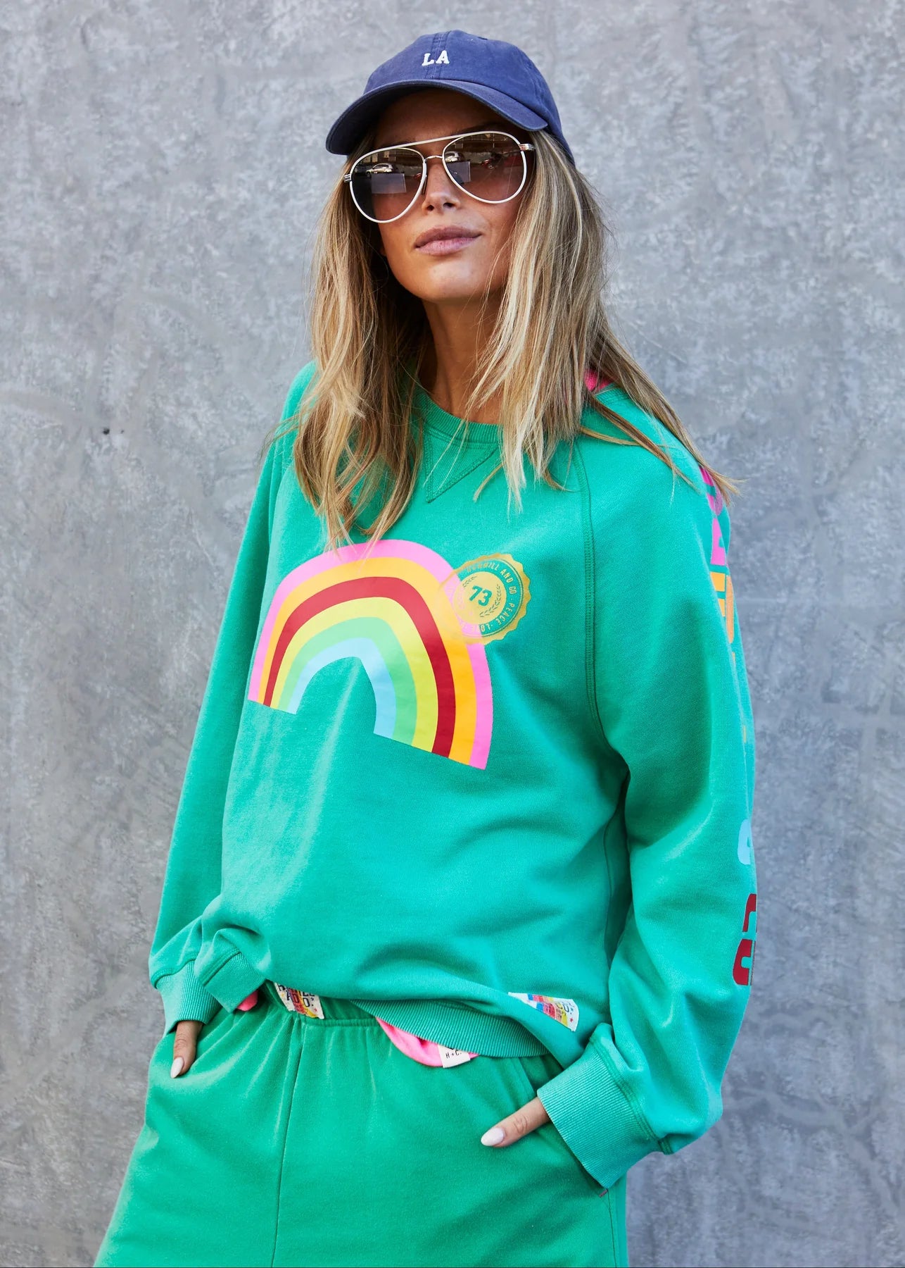 hammill and co womens green rainbow sweater with rainbow graphic print