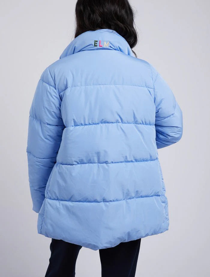 back of Women wearing puffer jacket in light blue
